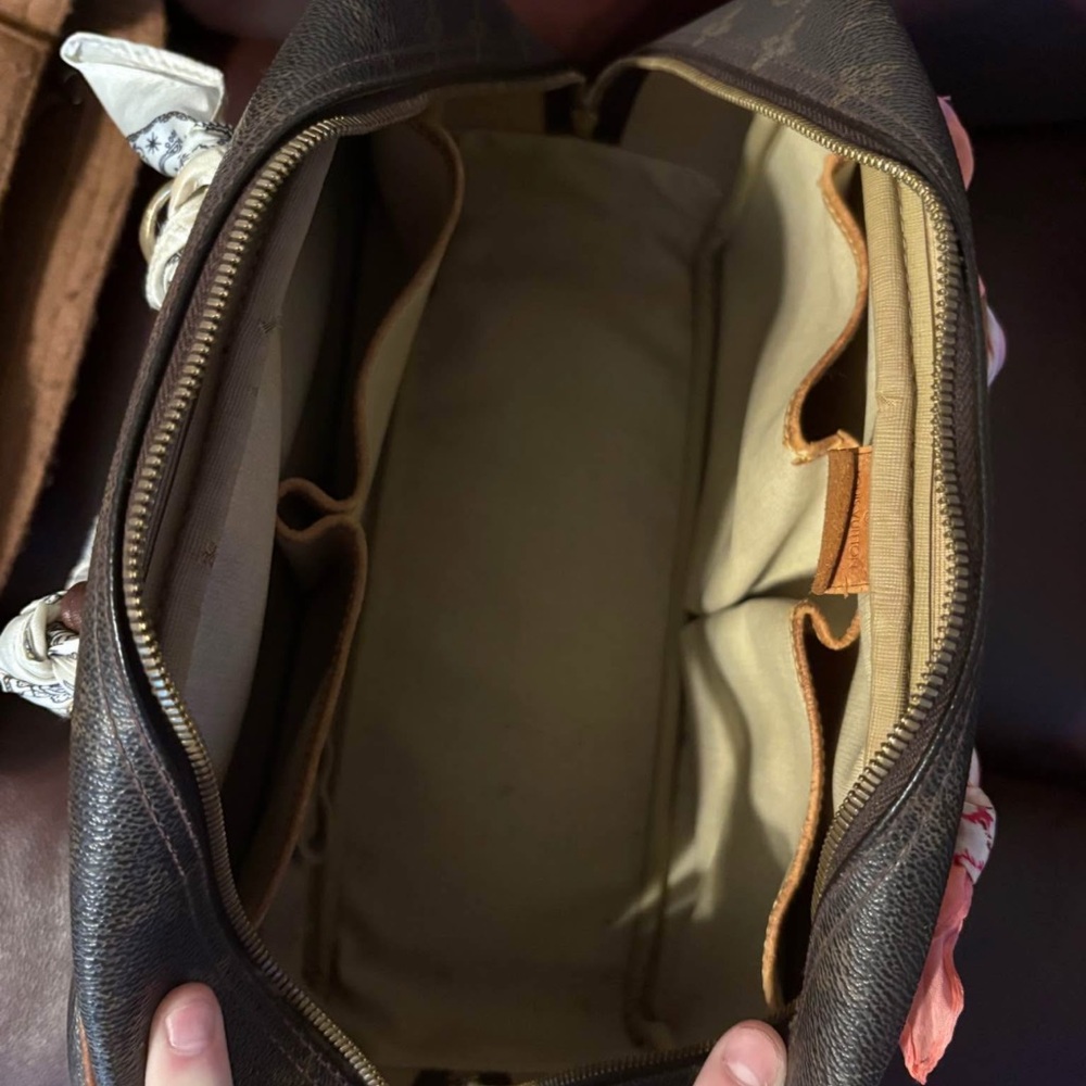 Brown Designer Handbag With Patterned Accents - image 4